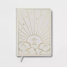 a white notebook with the words daydreames and night time written on it