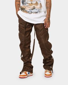 Change up your look with the Snap Zipper II Cargo Pants. Featuring zips down the side seams that are covered with snap buttons, these pants don't skimp on the detail. They also sport cargo pockets, a self-fabric built-in belt, and velcro closures at the cuffs. Cop yours today at Culture Kings. 

- Relaxed fit
- Snaps and zipper at outseam
- Tapered leg
- Built-in belt 
- Stiff fabric
- Cargo pockets
- Velcro closure at cuff
- Composition: 100% Nylon 
- Colour: Brown
- Style: M2019-P636-BRO Brown Full-length Parachute Pants For Streetwear, Streetwear Nylon Pants With Belt Loops, Nylon Parachute Pants With Belt Loops For Streetwear, Sporty Nylon Cargo Pants With Belt Loops, Brown Bottoms With Belt Loops For Outdoor, Sporty Nylon Pants With Belt Loops, Nylon Cargo Pants With Belt Loops For Outdoor Activities, Brown Streetwear Pants With Side Pockets, Brown Pants With Side Pockets For Streetwear