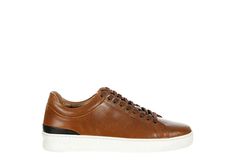 Franco Fortini Devon Men s Lace-Up Sneaker Keep your style sharp and clean with the Devon men s lace-up Sneaker from Franco Fortini. With a smooth leather upper featuring lace-up closure for a secure fit, this versatile Sneaker can be paired with anything from jeans or khakis to dress slacks. A Cushioned footbed offers all-day comfort, while the outsole provides excellent traction. Leather upper Lace-up closure Round toe Cushioned footbedTraction outsole Brown Lace-up Work Sneakers, Brown Lace-up Sneakers For Work, Brown Slip-on Sneakers With Reinforced Toe, Men’s Black Unlined Leather Sneakers Size 11 1/2, Dress Slacks, Rack Room, Rack Room Shoes, Smooth Leather, Devon