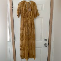 Nwt Honey Punch Embroidered Lace Maxi Romper Dress With Plunging Neckline In Size Small. Color Is Mustard Yellow Long Yellow Dress For Fall, Yellow Embroidered V-neck Dress, Spring Embroidered Yellow Maxi Dress, Spring Yellow Embroidered Maxi Dress, Yellow Maxi Dress With Floral Embroidery, Yellow Embroidered Maxi Dress For Beach, Yellow Embroidered Maxi Dress For The Beach, Yellow Lace Maxi Dress For Summer, Yellow Lace Dress For Brunch