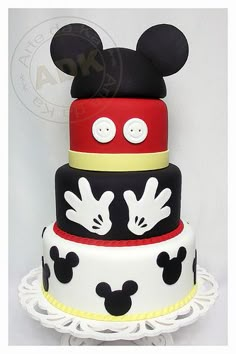 a mickey mouse cake is shown on a table