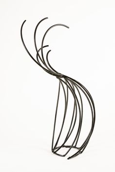 a metal sculpture is shown against a white background