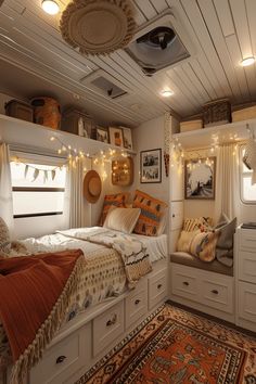 a bed room with a neatly made bed and lots of lights on the ceiling above it