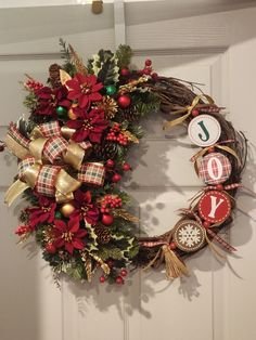 a christmas wreath hanging on the front door