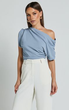 Nalfie Top - Asymmetrical Top in Pastel Blue | Showpo USA Summer Workwear Top With Asymmetrical Neckline, Blue Off-shoulder Evening Tops, One Shoulder Summer Blouse For Work, One Shoulder Summer Workwear Blouse, Chic Blue Evening Top, Versatile One Shoulder Top For Spring Party, Versatile One-shoulder Top For Spring Party, One-shoulder Summer Top For Workwear, Summer One-shoulder Top For Workwear