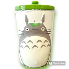 a totoro cup with a green lid