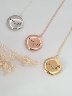 Antique and vintage inspired silver, gold or rose gold plated round floral embossed locket engraved with flying birds on the back of the locket.   Pictures can be added to both sides - see video tutorial https://www.wikihow.com/Put-a-Picture-in-a-Locket    Lovely bridesmaid gift, perfect for a keepsake gift. Simple and elegant. Locket measures 25mm and hangs on a fine silver, gold or rose gold plated chain. Necklaces will arrive in a bag ready for giving. Elegant Round Pendant Locket Necklace With Birth Flower, Elegant Round Locket Necklace With Birth Flower, Elegant Birth Flower Round Pendant Locket Necklace, Nature-inspired Round Birth Flower Necklaces, Nature-inspired Round Birth Flower Necklace, Round Nature-inspired Birth Flower Necklace, Rose Gold Round Locket Necklace For Gifts, Round Rose Gold Locket Necklace For Gifts, Silver Locket Necklace With Birth Flower Round Pendant