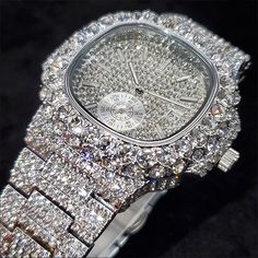 THE EPITOME OF TIMELESS ELEGANCE AND UNBRIDLED LUXURY: OUR VVS ICED OUT WATCH. This breathtaking timepiece is a true masterpiece of craftsmanship, featuring a stunning array of glittering diamonds and precious gemstones, carefully set into a sleek and stylish design that will leave all onlookers in awe. With its precise timekeeping and unparalleled aesthetic appeal, this watch is the ultimate statement piece for anyone who demands nothing but the best. Whether you're hitting the town or attendin Hip Hop Street Style, Iced Out Watch, Hip Hop Watches, Diamond Watches, Diamond Watches For Men, Wristwatch Fashion, Luxury Diamonds, Diamond Glitter, Watch Gifts