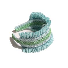 Super fun, oversized headband adorned with adorable multi-color smocking lining the top of the band. The base is covered in a comfortable Classic Cotton Poplin fabric with 3D pleating and ruffling emerging from the smocking detail. A true match when worn with this season's smocked styles. SKU: SS24-AU-AC462S CO151 BAY Green Headband For Beach And Spring Season, Green Headband For Beach In Spring, Green Headband For Beach And Spring, Top Women Shoes, One Piece Top, Cotton Poplin Fabric, Poplin Fabric, Swimwear Accessories, Baby Bag