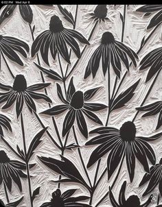 an image of black and white flowers on paper