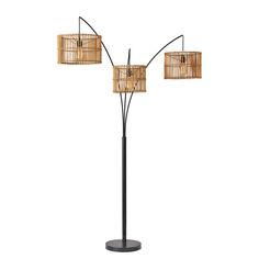 a floor lamp with three lamps on it and two shades of bamboo in the shade