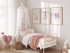 there is a white bed in the room with pink decorations on the wall and pictures above it