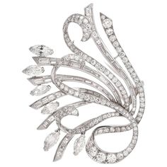 This stunning vintage 1960s lapel brooch of opulent aesthetic and unmatched sophistication depicts a very precious floral bouquet with marquise diamonds simulating flowers and buds and baguette and round-faceted diamonds covering the romantically scrolled elongated stems. Rendered in solid platinum, this alluringly Edwardian inspired lapel pin brooch is swathed cumulatively in 15.51cts of high quality diamonds graded H-I color and VSclarity with few SI’s. This artfully designed floral bouquet fe Argentium Silver Jewelry, Pencil Artwork, Lapel Brooch, Jewelry Appraisal, Gold Pin, Antique Brooches, Diamond Brooch, Expensive Jewelry, Art Deco Diamond