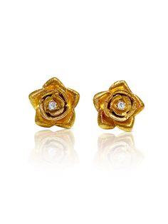 "Cute and dainty 14k solid gold flower design with a natural diamond set in the center. These earrings are set in 14k gold push back closure and a brushed, texture gold finish. Hypoallergenic and double rhodium plated for an extra shiny finish. <> ✔ 14k Solid Gold ✔ Length: 1.50 cm ✔ Width: 1.50 cm ✔ Diamonds: 2 natural diamonds, round cut, 0.05 carats ✔ Hypoallergenic ✔ Double Rhodium Plated Finish ✔ Weight: 6.2 grams Diamond stud earrings: https://www.etsy.com/listing/805062727/tiny-natu Gold Diamond Flower Earrings For Anniversary, Gold Flower-shaped Diamond Earrings For Anniversary, Gold Flower-shaped Diamond Earrings With Brilliant Cut, Gold Flower-shaped Diamond Earrings With Accents, Anniversary Yellow Gold Flower Earrings With Diamond Accents, Yellow Gold Flower Earrings With Diamond Accents, Flower Shaped Earrings With Single Cut Diamonds, Diamond Flower Earrings For Anniversary, Gold Flower Earrings With Diamond Accents