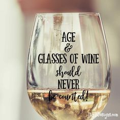 a wine glass with the words age and glasses of wine should never be overrated