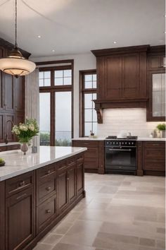 Charming traditional kitchen with central island Dark Tile Kitchen Floors Wood Cabinets, Traditional Wood Kitchen Cabinets, Classic Brown Kitchen, Dark Hardwood Kitchen, Brown Aesthetic Kitchen, Kitchen Ideas With Brown Cabinets, Black Ensuite, Kitchen Ideas Brown Cabinets, Classic Interior Design Kitchen