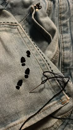 an old pair of jeans with holes in them