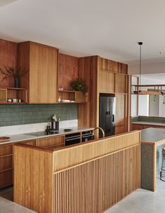 a kitchen with wooden cabinets and an island