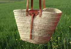 Our Straw Bag is Handwoven In Fez Souk From Moroccan Palme Leaves and leather handles . Our Leather Shopping Basket is suitable for all situations as Shopping, hanging out...  and so on is the Good choice for you. MEASUREMENTS - Length : 42 cm / 16.5 in - Height : 29 cm / 11.4 in - Width : 16 cm / 6.3 in Thank you so much for visiting our Shop! Explore all our collection at : https://www.etsy.com/shop/MoroccanBestShop Leather Basket Beach Bag For Everyday, Leather Handle Basket Shoulder Bag For Travel, Leather Tote Beach Bag With Handles, Leather Straw Bag With Rolled Handles For Travel, Leather Tote Beach Bag With Leather Handles, Leather Straw Bag For Travel, Leather Beach Bag Tote With Leather Handles, Summer Leather Straw Travel Bag, Summer Leather Tote Bag