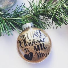 a christmas ornament with the words our first christmas is mr and mrs on it