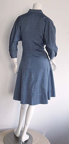 For Sale on 1stDibs - Incredible 1940s B. Altman & Co. Cotton Denim/Chambray dress, with horse buttons up bodice, and at sleeve cuffs! Beautiful lightweight fabric, with a flattering Denim Chambray Dress, Chambray Dress, Lightweight Fabric, Chambray, Bodice, Evening Dresses, High Neck Dress, Button Up, The Incredibles