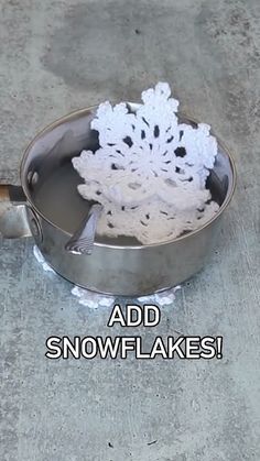 there is a snowflake in the bottom of a pan on the ground with words above it