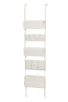 a white shelf with four bins and two shelves on each side, in the shape of a ladder