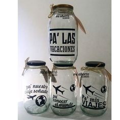 three glass jars with labels on them sitting next to each other