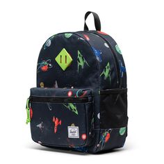 Make their first backpack a great one. The Herschel Heritage Kids Backpack is made from recycled EcoSystem fabrics and sized for school and play, this is our go-to backpack for young adventurers. Herschel Heritage Kids Backpack Details: Sized for 3 - 7 years old EcoSystem 600D Fabric Made from 100% recycled post-consumer water bottles Wipeable front, bottom, and side panel liner Signature diamond detail Zippered closures with Prusik cord pulls Carry comfortably with padded shoulder straps Remova Green Standard Backpack For Camping, Green Backpack For Camping, Green Camping Backpack, Back To School Adventure Backpack, Blue Camping Backpack, Green Standard Backpack, Blue Backpack For Camping, Playful Backpack For End Of School Year Outdoor Use, Back To School Nylon Backpack For Adventure