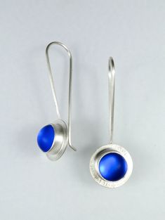 Art Glass & Silver Earrings - Simply modern, these 9mm frosted glass cabochons have an ethereal, colored glow as they swing on long French ear wires. Handmade bezels of recycled sterling and fine silver. Clear rubber earring stoppers are included. Modern Sterling Silver Earrings With Cabochon, Modern Blue Sterling Silver Earrings, Modern Blue Long Drop Jewelry, Modern Blue Long Drop Earrings, Blue Fusion Style Round Earrings, Blue Cabochon Sterling Silver Earrings, Contemporary Blue Sterling Silver Jewelry, Silver Smithing Jewelry, Silversmith Jewelry