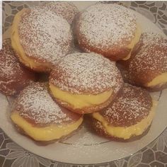 powdered sugar covered pastries on a plate