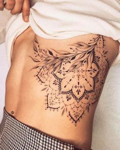 a woman with a tattoo on her stomach