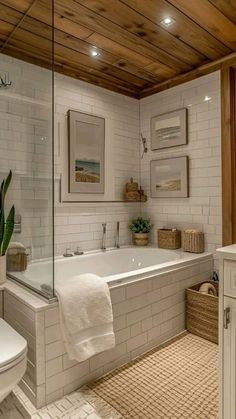 a bathroom with a tub, toilet and sink