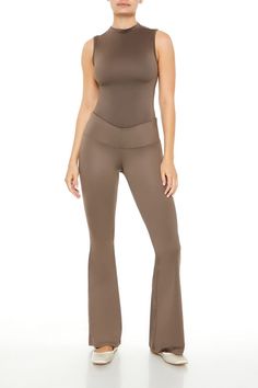 Seamless knit bodysuit featuring mock neck, sleeveless cut, and thong bottom cut. | 94% nylon, 6% spandex | Machine wash cold | Model is 5'10" and wearing Small | Seamless Mock Neck Thong Bodysuit Stretch Full-length Bodysuit, Stretch Bodysuit With Built-in Bra And High-cut Leg, Seamless High Neck Bodysuit In Solid Color, Seamless Stretch Bodysuit With High-cut Leg, Stretch High Cut Seamless Bodysuit, Stretch Seamless High Cut Bodysuit, Stretch Bodysuit With Seamless Construction, Stretch High Cut Bottoms With Seamless Construction, High Cut Stretch Bottoms With Seamless Construction