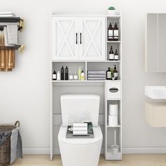 a white toilet sitting in a bathroom next to a shelf