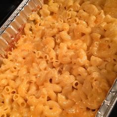 macaroni and cheese is in a pan on the stove