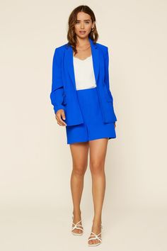 A jolt of neon blue brings a fresh, fun energy to the tailored styling of this welt-pocket blazer. Pair the open-front jacket with our matching shorts for a modern take on power dressing. AVAILABLE IN PLUS PAIR IT WITH •Notched lapels •Open front •Welt pockets •Long sleeves •Lined Item Number: 23962 100% Polyester Semi-formal Spring Blazer With Pockets, Notched Blazer For Spring Workwear, Spring Notched Blazer For Workwear, Spring Notched Blazer For Work, Spring Blazer With Notch Lapel And Hidden Buttons, Spring Blazer With Hidden Button And Notch Lapel, Spring Notch Lapel Blazer With Hidden Button Closure, Chic Semi-formal Blazer With Pockets, Tailored Blazer Dress With Pockets And Notch Lapel