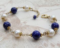 Lapis Lazuli Bracelet, Blue Stone Bracelet, Real Lapis, Pearls, Gold Navy Bracelet, September Births Elegant Lapis Lazuli Gemstone Bracelets, Elegant Pearl Bracelet With Round Natural Stones, Elegant Pearl Bracelet With Natural Stones, Handmade Elegant Blue Pearl Bracelet, Elegant Handmade Blue Pearl Bracelet, Elegant Handmade Lapis Lazuli Bracelets, Adjustable Elegant Lapis Lazuli Bracelets, Elegant Lapis Lazuli Bracelets For Gifts, Elegant Round Pearl Bracelet With Natural Stones