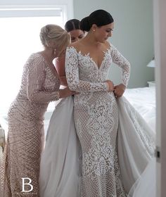 two women in wedding dresses are looking at each other's dress on the instagram page