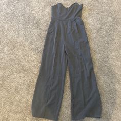 Grey Strapless Jumpsuit. Size Large. Never Worn High Waist Strapless Jumpsuit With Pockets, Fitted Strapless Jumpsuit With Pockets For Spring, Casual Strapless Fitted Jumpsuit With Wide Legs, Fitted High-waisted Jumpsuits And Rompers For Summer, Fitted High-waisted Summer Jumpsuits And Rompers, Fitted Strapless Jumpsuits And Rompers With Pockets, Fitted High Waist Strapless Jumpsuit With Pockets, Fitted Strapless Jumpsuit With Pockets, Fitted High-waist Strapless Jumpsuit With Pockets