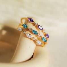 M A R Q U I S E ∙ B I R T H S T O N E ∙ R I N G  Your ultimate stacking ring has arrived! Our Triple Marquise Birthstone Ring allows you to customize to the stone you want. With delicate CZ Diamond gemstones in between each marquise birthstone, this ring shines with even more sparkle. * Material: High Quality Solid 925 Sterling Silver  * Finish: Sterling Silver ∙ 18K Gold ∙ Rose Gold  * Featuring a ~1mm Dainty Ring Band with three ~3.5 x 2mm Marquise Gemstones and ~1mm Round CZ Diamond Stones. ♡ Custom Gemstone Rings, Initial Tag Necklace, Dainty Initial Necklace, Stacker Rings, Marquise Ring, Mother Rings, Anniversary Jewelry, Jewelry Birthday, Birthday Jewelry Gift