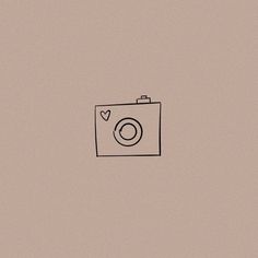 a camera with a heart drawn on the front and side, in black ink against a beige background