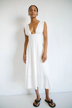 ELVA DRESS OFF-WHITE – The Line by K V-neck Dress With Ruched Bodice For Brunch, V-neck Midi Dress With Ruched Bodice For Date Night, Fitted V-neck Dress With Flattering Silhouette For Summer, Fitted V-neck Maxi Dress In Viscose, V-neck Dress With Ruched Bodice For Daywear, Fitted V-neck Dress With Gathered Neckline, Ruched V-neck Fitted Bodice Dress, V-neck Midi Dress With Ruched Bodice For Brunch, Chic V-neck Dress With Ruched Bodice