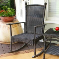 a rocking chair and ottoman on a porch