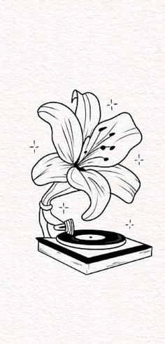 a drawing of a flower on top of a record player