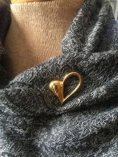 "Vintage BEAU sterling/gold vermeil heart shape brooch - beautiful simplistic design, with one side open. -item is sterling with gold overlay (vermeil).  -NOTE: there is some small tarnish marks (see photos) mostly on back side. -Would look stunning on clothing, scarf, choker neck piece, hat. -This brooch is sold in \"as IS vintage condition\", you are responsible for viewing all photos and reading discriptions. -No Returns (unless lost or damaged in transit) Please feel free to contact me with Scarf Choker, Heart Fashion, Neck Choker, Gold Overlay, Heart Brooch, Simplistic Design, Neck Piece, Open Heart, Valentines Gift