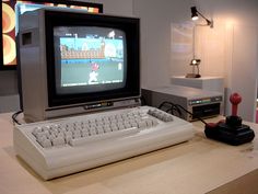 an old computer sitting on top of a desk