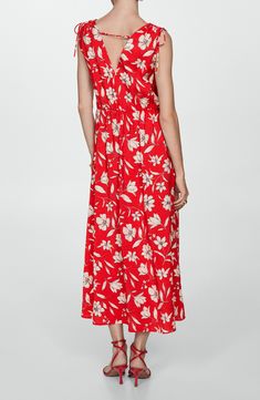 Whether heading to brunch or a garden party, you'll look effortlessly charming in this flowy maxi dress covered in romantic blooms and detailed with dainty ties at the shoulders. Slips on over head Surplice V-neck Sleeveless 85% viscose, 15% polyamide Machine wash, line dry Imported Red Floral Print Maxi Dress For Spring, Red Spring Maxi Dress For Daywear, Feminine Red Maxi Dress For Vacation, Sleeveless Rayon Maxi Dress For Garden Party, Red Rayon Midi Dress For Spring, Red Maxi Dress For Summer Garden Party, Red Rayon Maxi Dress For Spring, Spring Red Rayon Maxi Dress, Red Floral Print Maxi Dress For Daywear