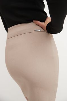 You know that some things never go out of fashion. Whether it’s representing your company at that big event or attending your friend’s birthday party, you can trust this classic, above-the-knee pencil skirt. Its soft waistband offers the perfect support for a slim silhouette, making you comfortable for long hours. As you take prospects through a demo or greet old friends for a brunch, this versatile skirt pairs easily with any sophisticated tops of yours. Made with a blend of rayon, nylon, and s Trendy Knee-length Office Bottoms, Trendy Knee-length Office Skirt, Trendy Knee-length Skirt For Office, Trendy Fitted Skirt For Formal Occasions, Trendy Fitted Mini Skirt For Formal Occasions, Trendy Fitted Formal Skirt, Trendy Knee-length Skirt For Workwear, Chic Knee-length Mini Skirt, Classic Knee-length Pencil Skirt For Party