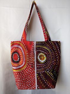 Introducing our Handmade Tote Bag crafted with Indigenous Fabric - a unique and culturally rich accessory thoughtfully created by our small business. This tote bag not only embodies functionality but also celebrates the artistry and heritage of Indigenous communities, offering a distinctive blend of practicality and cultural significance. 🌟 Key Features: Cultural Connection: Immerse yourself in the beauty and history of Indigenous artistry with our handmade tote bag, crafted using authentic Ind Artistic Square Bag For Daily Use, Artistic Square Bags For Daily Use, Artisan Bags With Removable Pouch For Daily Use, Artsy Rectangular Shoulder Bag For Shopping, Artistic Red Shoulder Bag For Everyday, Artistic Red Shoulder Bag For Everyday Use, Artistic Brown Bag For Gifts, Artsy Handmade Tote Bag, Artistic Square Bags For Everyday Use